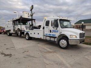 Towing by JL tow service company in , offering 24 hour towing near me