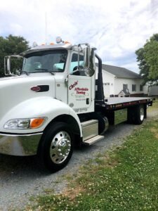 Raymonds Auto LLC tow service company in North Franklin, Connecticut offering 24 hour towing near me