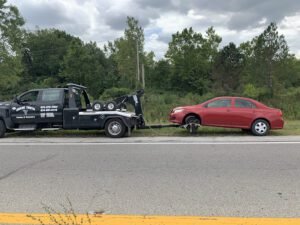 Shark Tooth Towing and Recovery tow service company in , offering 24 hour towing near me