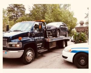 John & Sons Collision Inc tow service company in Rochester, New York offering 24 hour towing near me