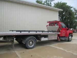New Hampton Auto Body, L.L.C. & Trailer Sales tow service company in New Hampton, Iowa offering 24 hour towing near me