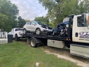 SJE TOWING tow service company in Owosso, Michigan offering 24 hour towing near me