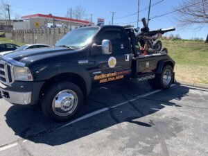 Dedicated towing llc tow service company in , offering 24 hour towing near me