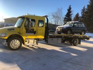 Midnight Sun Towing - Anchorage, Palmer, Wasilla, Eagle River tow service company in Anchorage, Alaska offering 24 hour towing near me