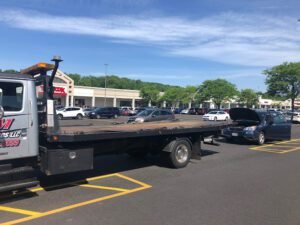 JPM Enterprise LLC tow service company in Ellington, Connecticut offering 24 hour towing near me